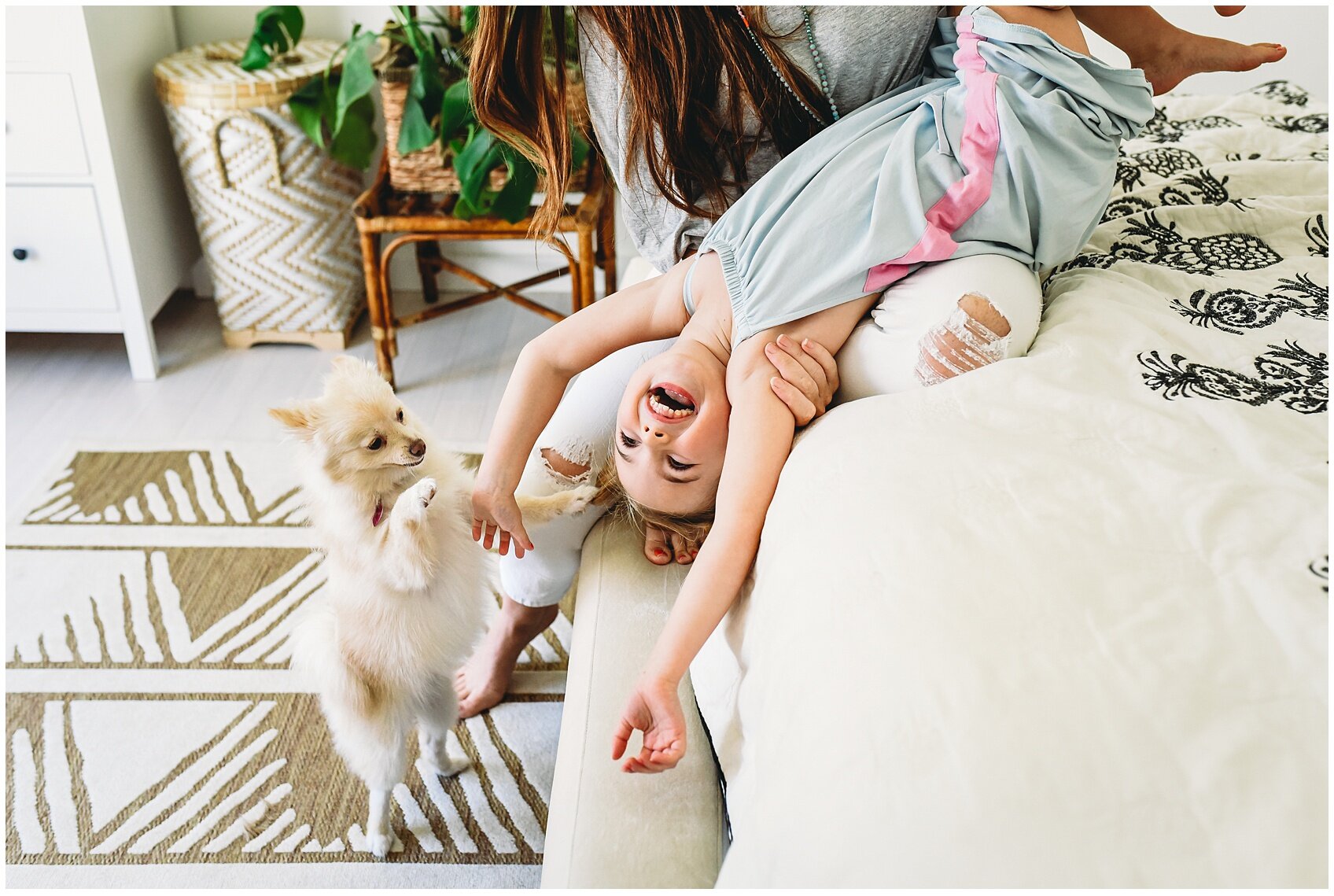 mother and daughter at home with dog