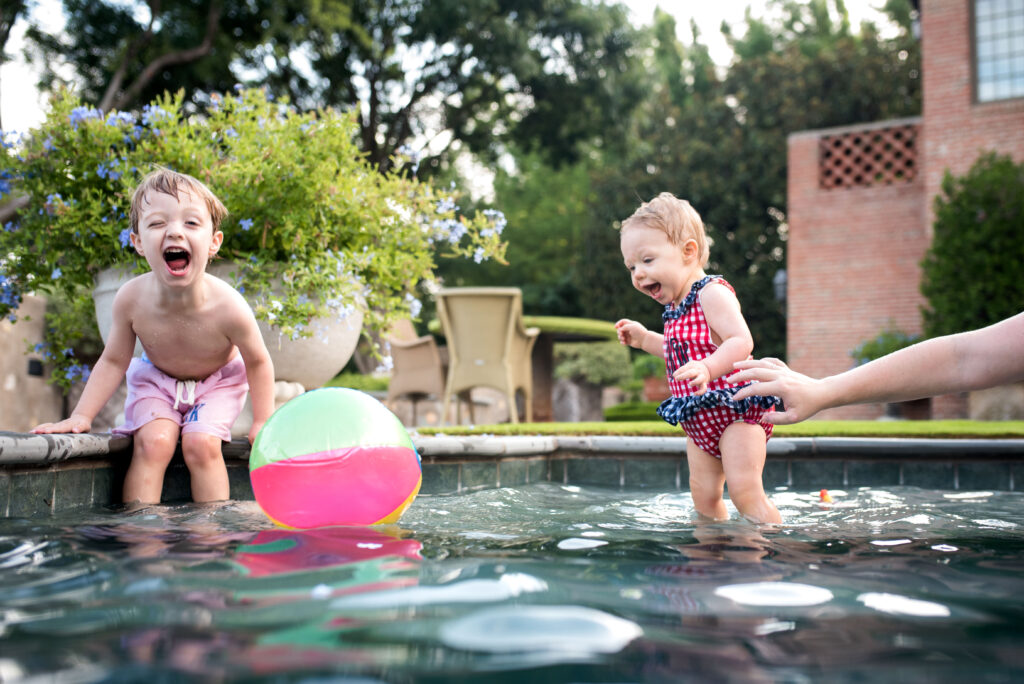 fort worth family photography outdoor swimming pool photo session with kids in the summer
