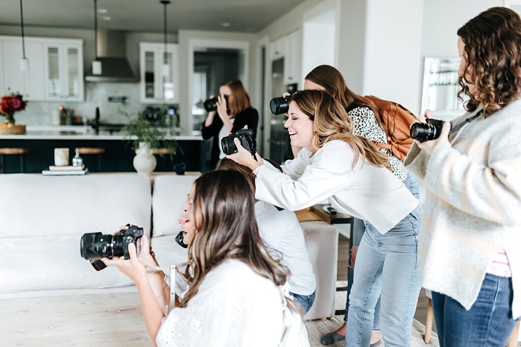 women photographing an in-home family session at a mastermind retreat with sabrina gebhardt