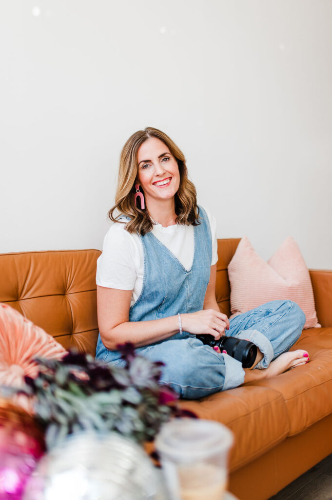 How to Build Client Loyalty That Keeps Clients Coming Back 3 photographer sitting on a couch about to chat about client loyalty in business