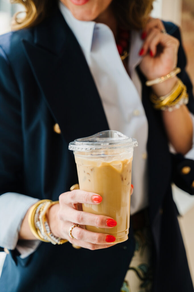 Lessons in Photography: What Challenging Sessions Can Teach You 3 Iced coffee, colorful accessories, and a polished outfit captured during a lifestyle branding session in a bright café.