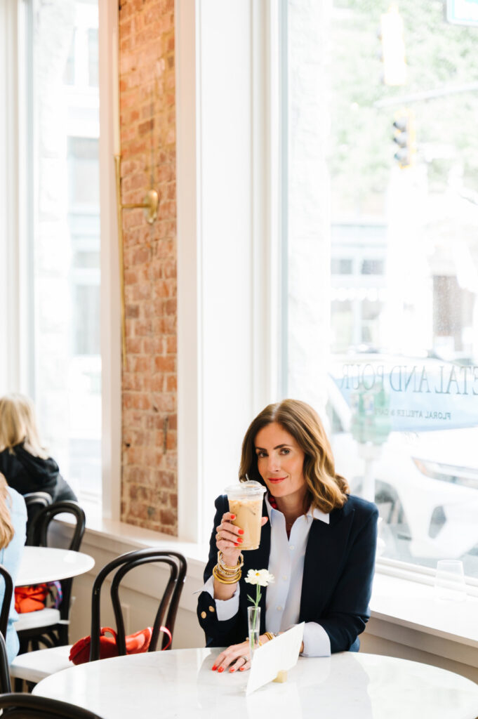 Lessons in Photography: What Challenging Sessions Can Teach You 5 Entrepreneur enjoying coffee in a sunlit café, illustrating how everyday moments often inspire the best lessons in photography.