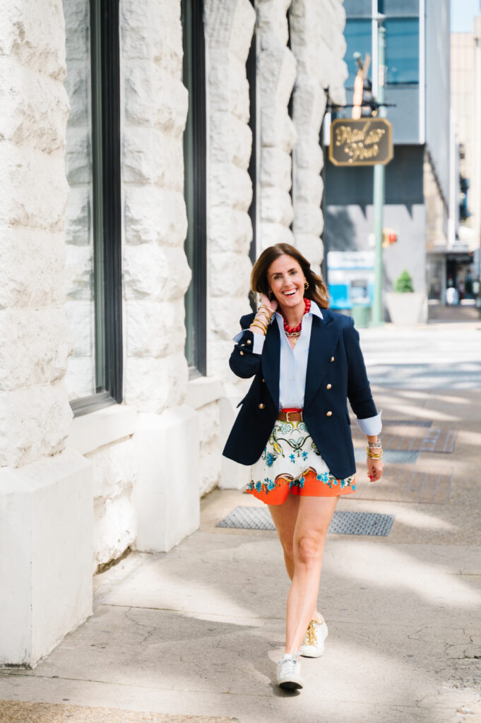 Photography Business Setup: How to Build a Business That Supports Your Life 3 Photographer walking through downtown as part of a photography business setup focused on creating a business that supports your life.
