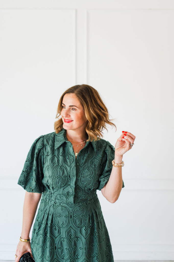 Photographer Sabrina Gebhardt in a green dress, sharing tips about choosing a photo editing platform.