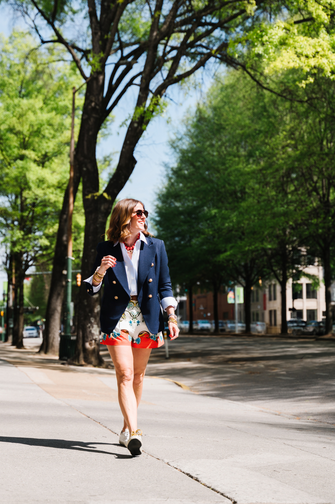 Building a Referral Network: The Most Overlooked Marketing Strategy for Photographers 1 Sabrina Gebhardt walking outdoors while sharing tips for building a strong referral network for photographers.